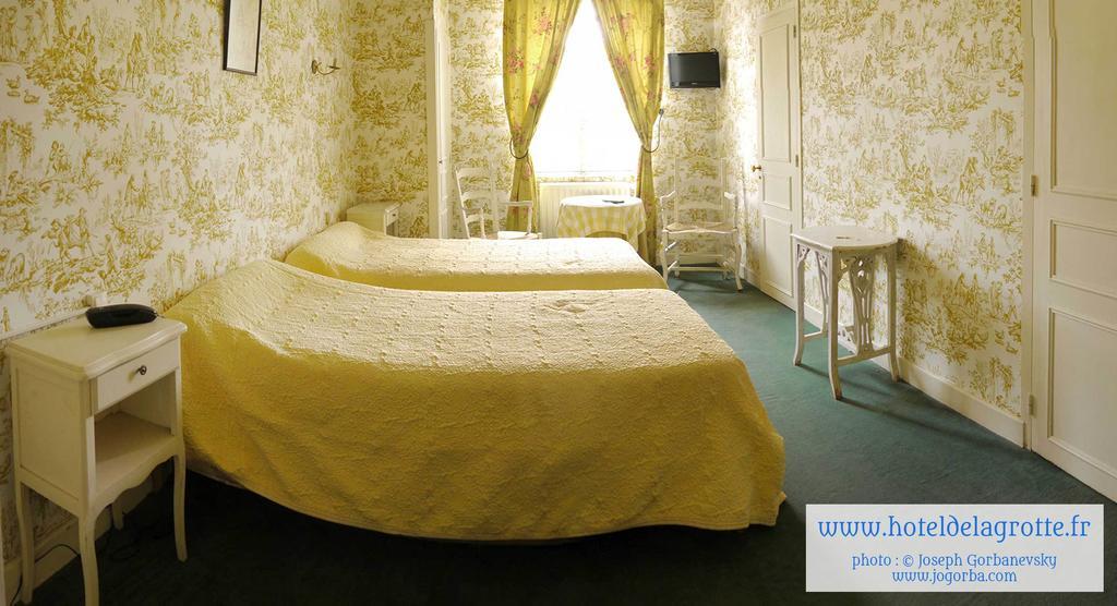 Hotel De La Grotte Монтіньяк Номер фото
